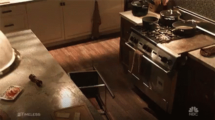 Kitchen With Stove Sink and Timeless Advertisement