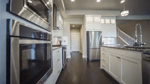 Kitchen With White Cabinets and Stainless Steel Appliances
