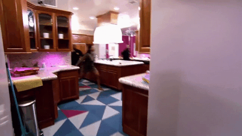 Kitchen With White Cabinets and Washing Machine Label