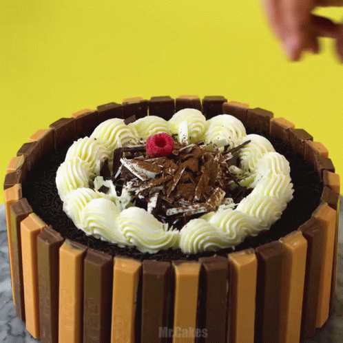 Kitkat Cake With Whipped Cream And Raspberries GIF