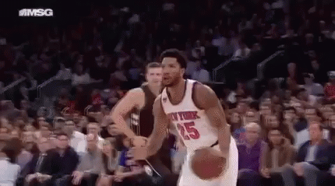 Knicks Player Dribbling Basketball in Front of Crowd