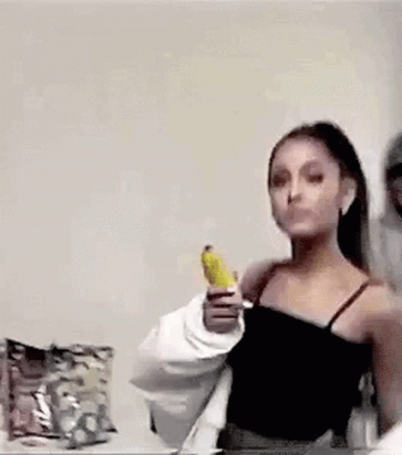 Ariana Grande Showing Bread Knife GIF