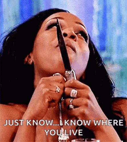 Tiffany Pollard Holding Knife While Eating GIF