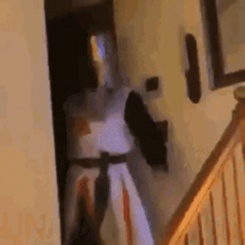 Knight in Armor Standing by Doorway