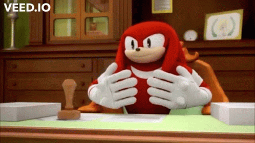 Knuckles The Echidna Sitting At Desk GIF