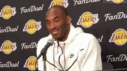Kobe Bryant Smiling Talking Into Microphone Lakers Wall