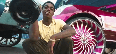 Kodak Black Holding Champagne Bottle With Cars GIF