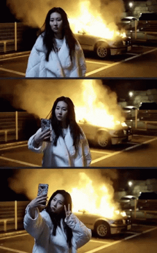 Korean Girl Doing Selfie Of Car Explosion GIF