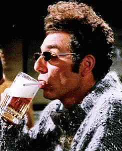 Kramer Wearing Sun Glasses Chugging Beer GIF