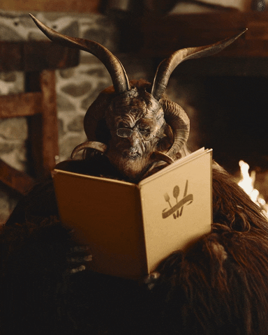 Krampus Reading A Book GIF