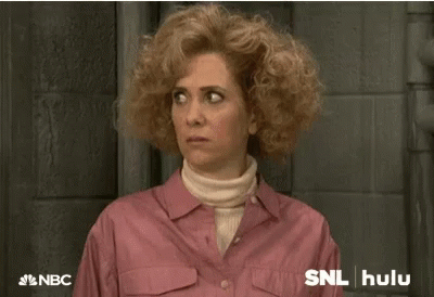 Kristen Wiig Smirk Sweater Weather Snl GIF