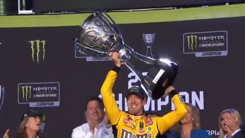 Kyle Busch Lifting Huge Trophy GIF
