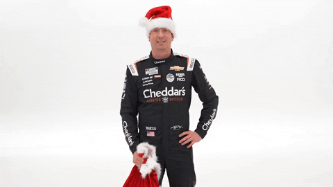 Kyle Busch Lifting Santa Bag Onto His Shoulder GIF