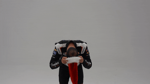 Kyle Busch Putting On Santa Hat GIF