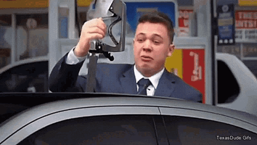 Kyle Rittenhouse Cries While Holding Gas Pump Meme GIF