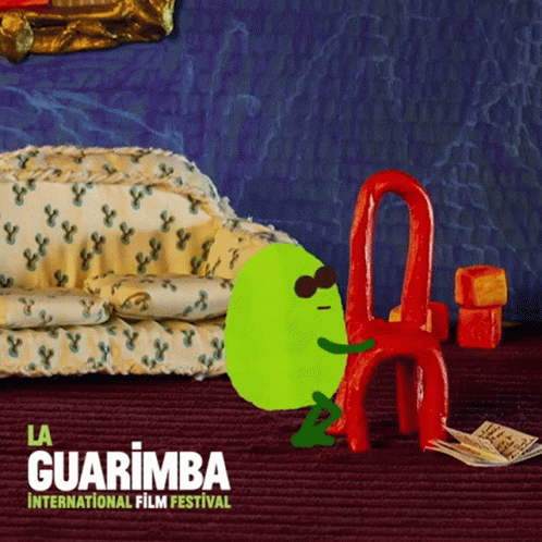 La Guarimba International Film Festival Green Character Sitting on Red Chair