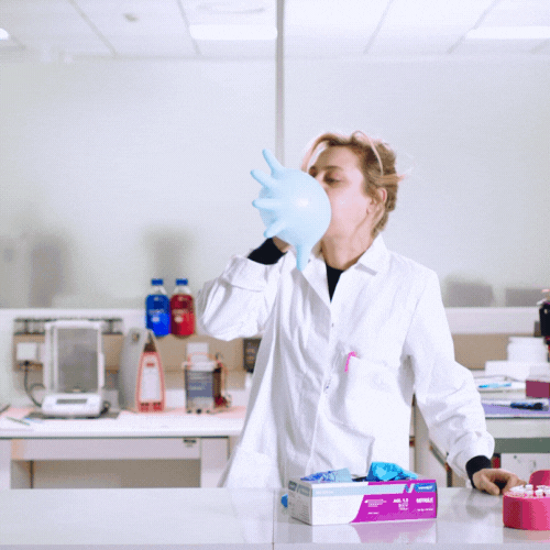 Laboratory Nurse Blowing Balloon GIF