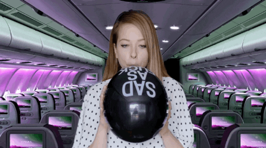Lady Blowing Balloon GIF