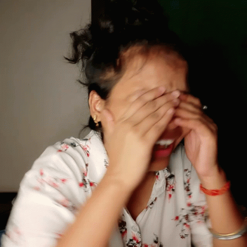 Lady Covering Mouth Holding In Laugh GIF