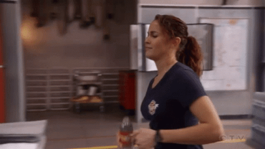 Lady Drinking Water While Walking GIF
