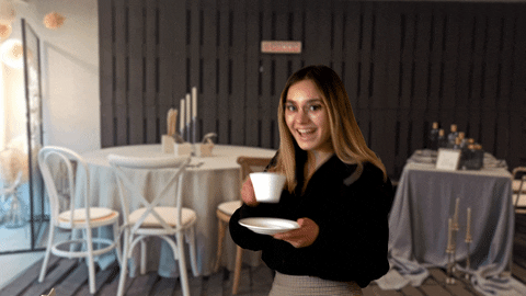 Lady Drinks Coffee And Greets Good Morning Work GIF