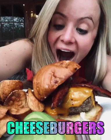 Lady Eating Cheese Burger Cross Eyed GIF