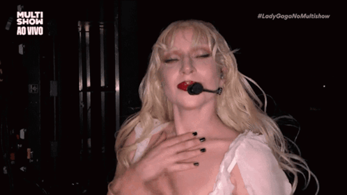 Lady Gaga in Black Dress With Ruffled Sleeves and Earrings
