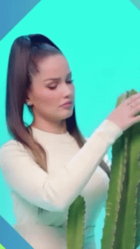 Lady Gently Petting Cactus GIF
