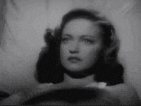 Lady Getting Hypnotize By Black Glass Necklace GIF