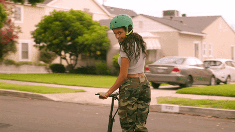 Lady In Scooter Passing By GIF
