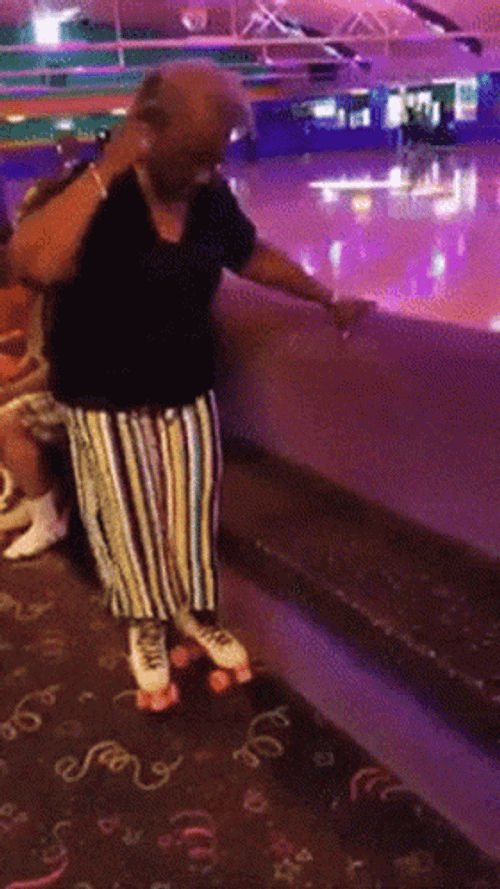 Lady Roller Skating Slips GIF