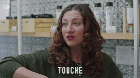 Lady Saying Touche While Pointing GIF