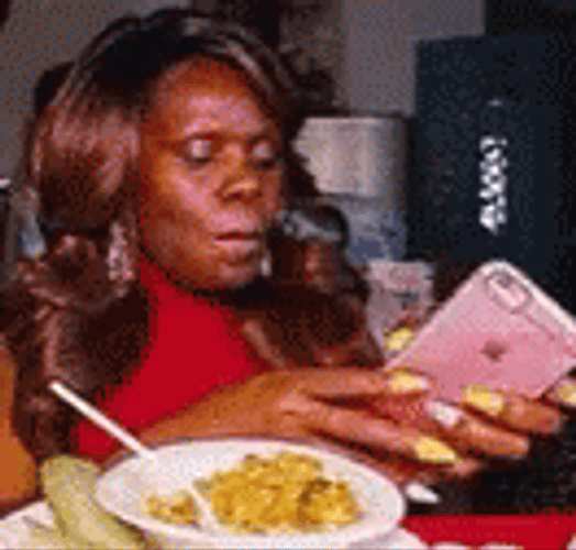 Lady Texting While Eating GIF