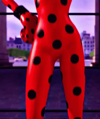 Ladybug Statue With Black Polka Dots On Pants GIF