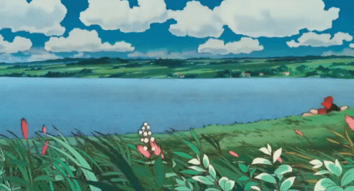 Lake With Person Laying On Shore GIF