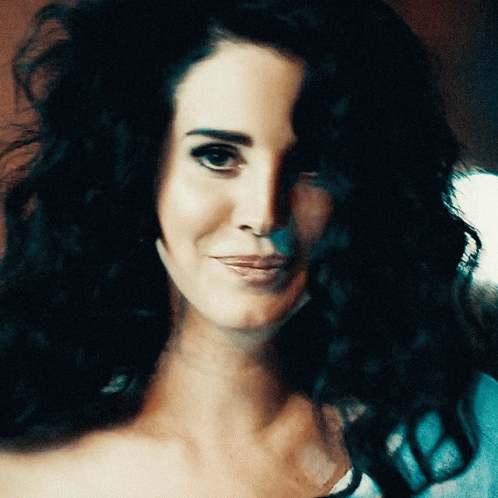 Lana Del Rey Covering Laugh GIF
