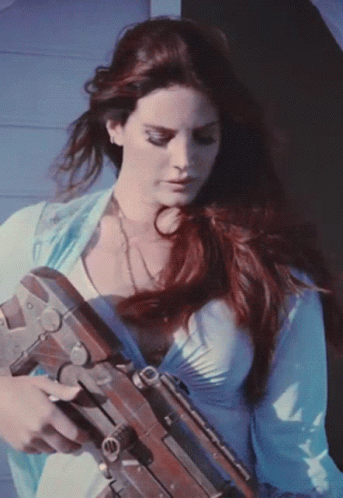 Lana Del Rey Holding A Gun GIF