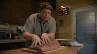 Lance Barber Touching Brisket GIF