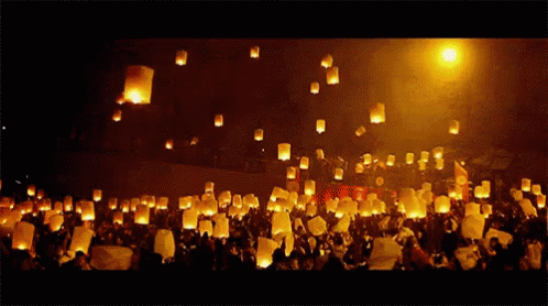Lanterns Thrown Into Air At Night GIF