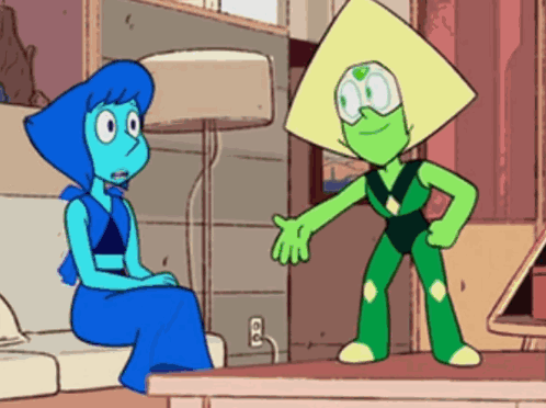 Lapis Lazuli And Peridot Are Sitting On A Couch Talking To Each Other . GIF