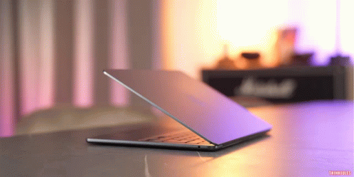 Laptop On Purple Background With Marshall Sign GIF