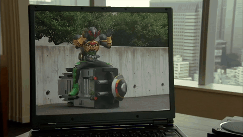 Laptop Showing Man in Superhero Costume