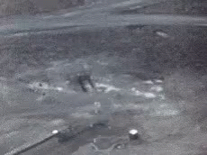 Large Black And White Hole In Ground GIF