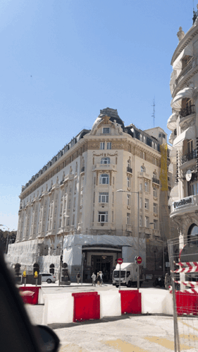 Large Building with Sign Saying Avenida