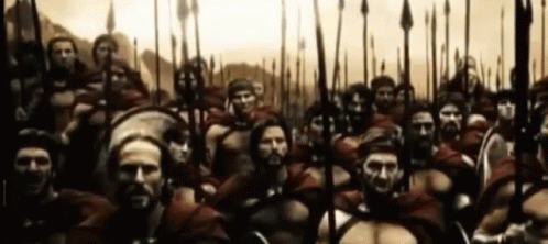 Large Group of Soldiers With Spears and Shields Standing in a Line
