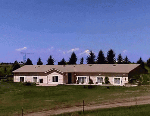 Large House in Grassy Field
