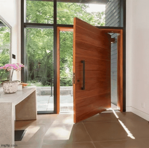 Large Open Wooden Door With Black Handle