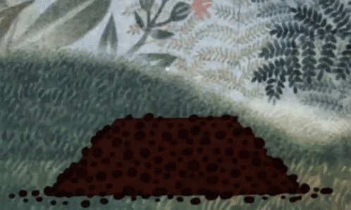 Large Pile Of Dirt In Grass GIF