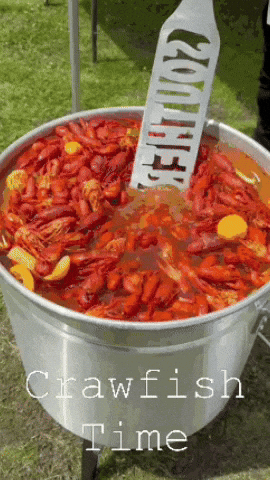 Large Pot of Crawfish With Spatula Saying Crawfish