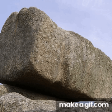 Large Rock in Front of Banner